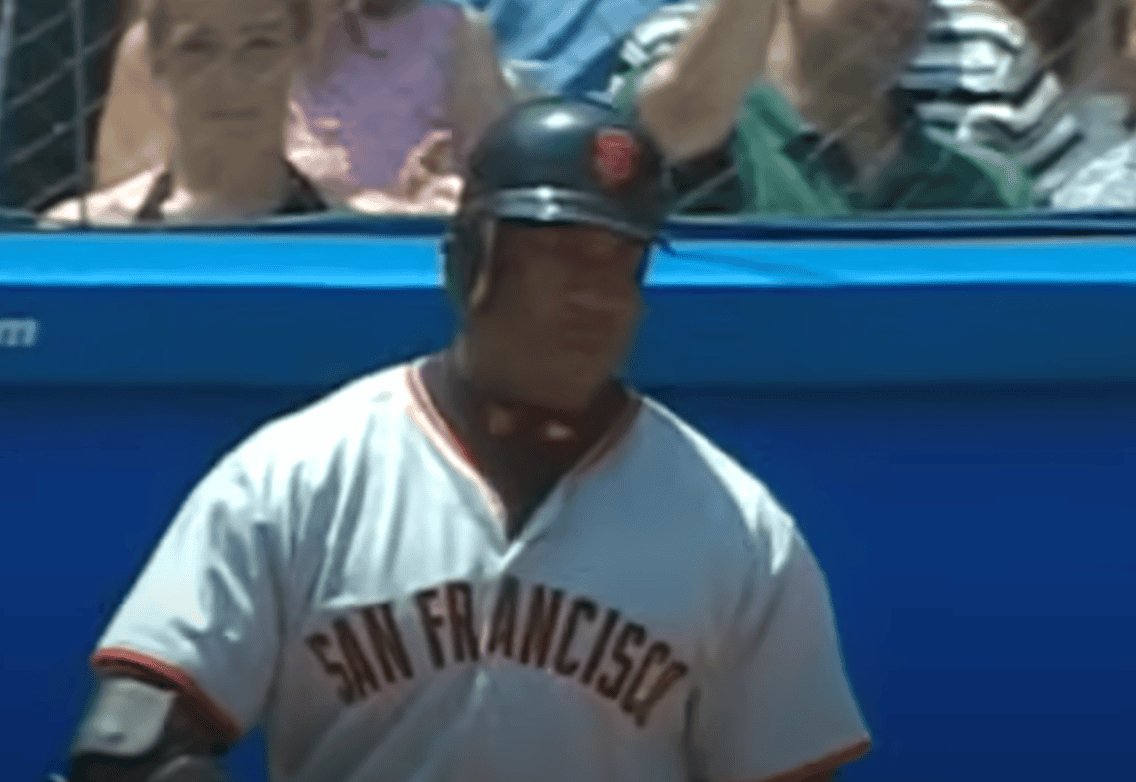 Barry Bonds showcasing his power hitting during a clutch moment in MLB.
